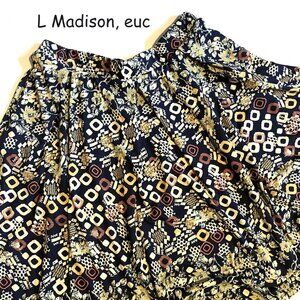 Large Lularoe Madison skirt, navy blue with cream and mustard shapes